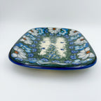 UNIKAT Forget Me Knot Pansy Daria platter, front view showing pansy border and center fern band