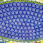 UNIKAT Garden Poppy Cezar platter, close-up of blue swirl-patterned center well