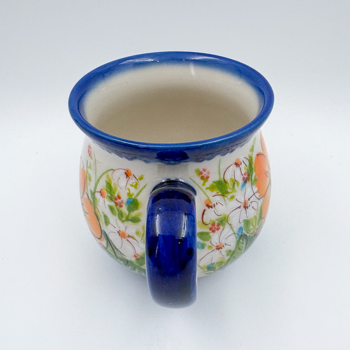 Orange Poppy bubble mug, angled top-down view showing interior