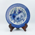 UNIKAT Blue Wildflower Patch pasta bowl, front view displayed on wooden stand showing blue floral pattern