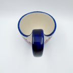 Top-down view into Red Berry loop-handle bowl mug showing interior and handle
