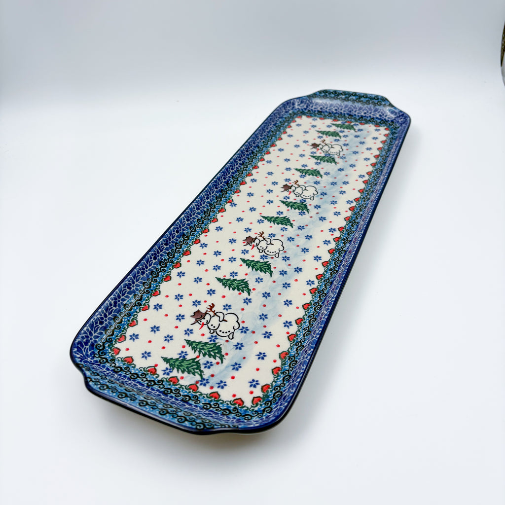 UNIKAT Snowman Stroll rectangular platter, angled top-down view of full platter with snowmen and pine trees