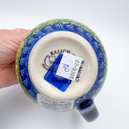 Bottom of Orange Poppy bubble mug showing Kalich Unikat stamp, held in hand