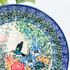 UNIKAT Hummingbird Meadow plate, close-up rim detail showing hummingbird and floral border pattern