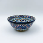 UNIKAT Cobalt Poppies bowl, front view showing peacock feather scale pattern on exterior