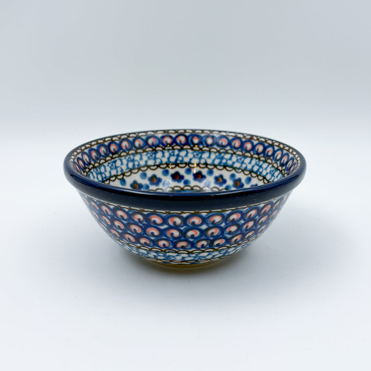 UNIKAT Cobalt Poppies bowl, front view showing peacock feather scale pattern on exterior