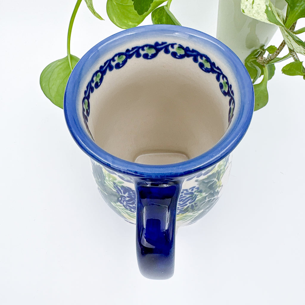 Top-down view into Wild Rose tulip mug showing rim pattern and handle