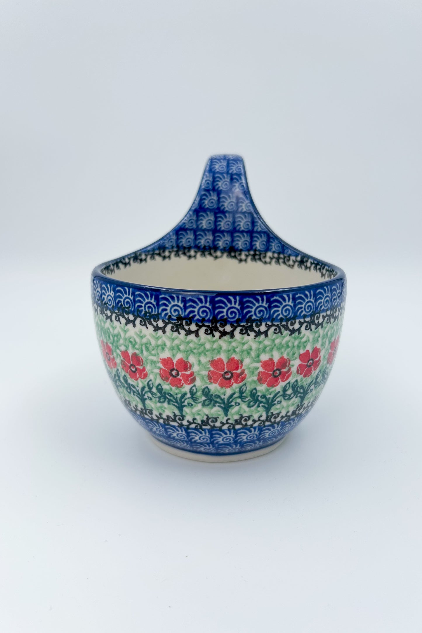 Polish pottery 16oz bowl with loop handle in the UNIKAT Candy Red Poppy pattern. It holds 16 oz of fluid.
Ceramika Artystyczna Company