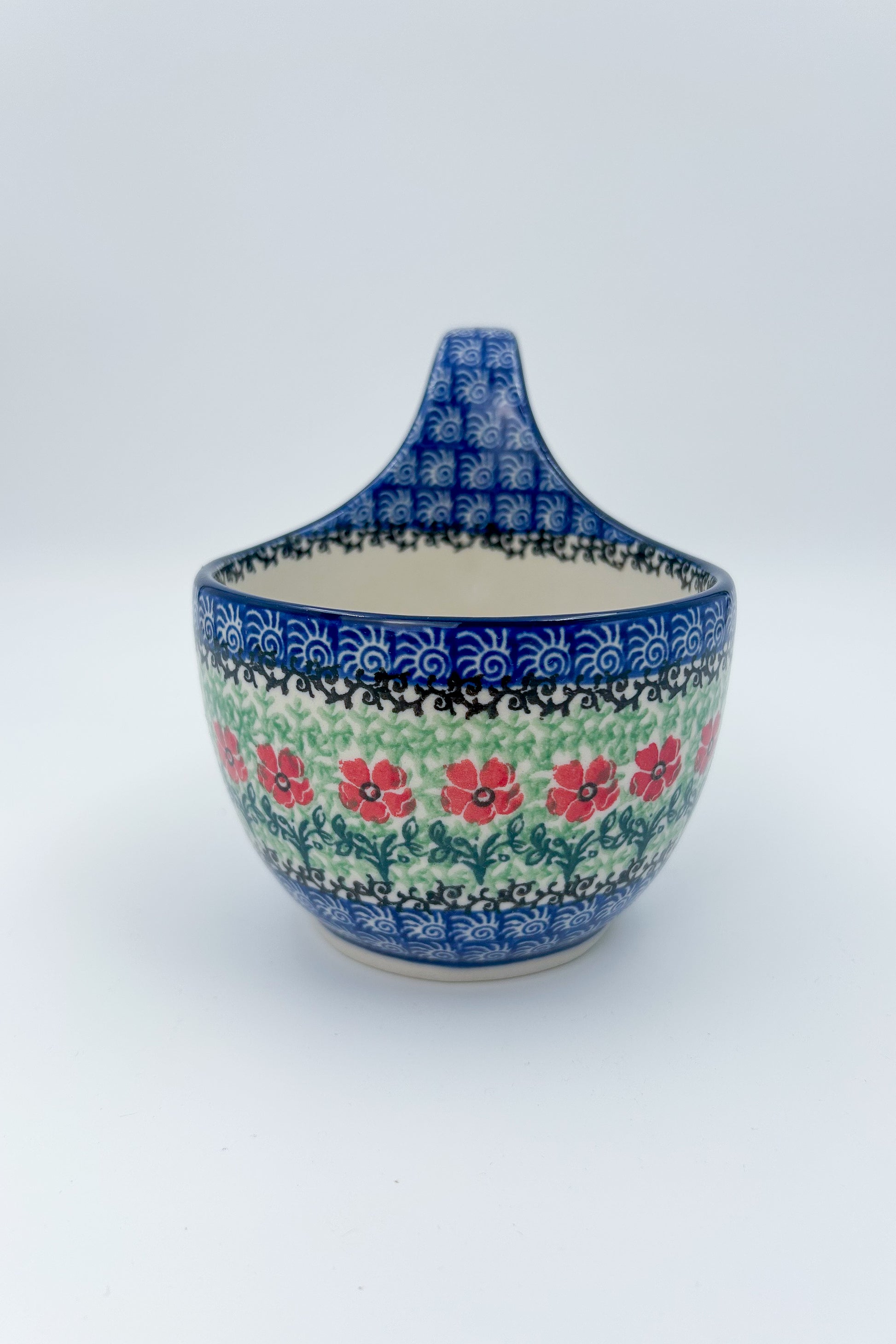 Polish pottery 16oz bowl with loop handle in the UNIKAT Candy Red Poppy pattern. It holds 16 oz of fluid.
Ceramika Artystyczna Company