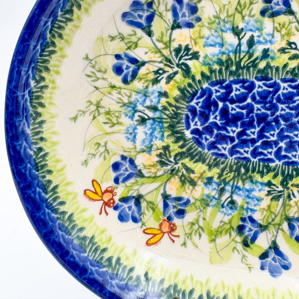 UNIKAT Bluebell Meadow oval platter, close-up corner view of bluebells, bees, and mosaic center