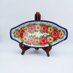 Garden Wreath boat platter with handles, front view on stand showing red and orange flower wreath
