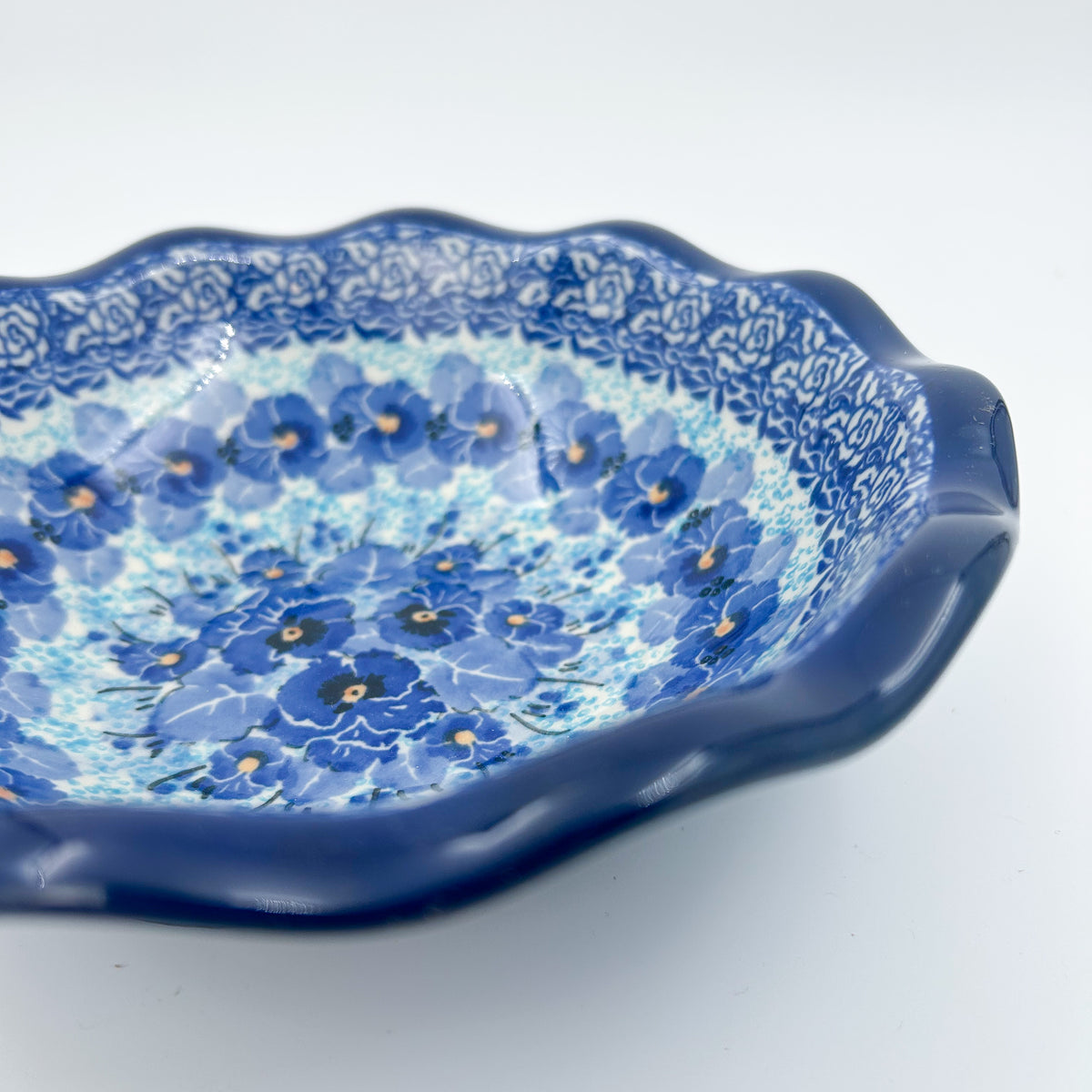 Deep Winter scalloped bowl, angled front view showing rim depth