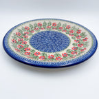 Midsummer Bloom plate, angled front view showing red flower ring around blue mosaic center