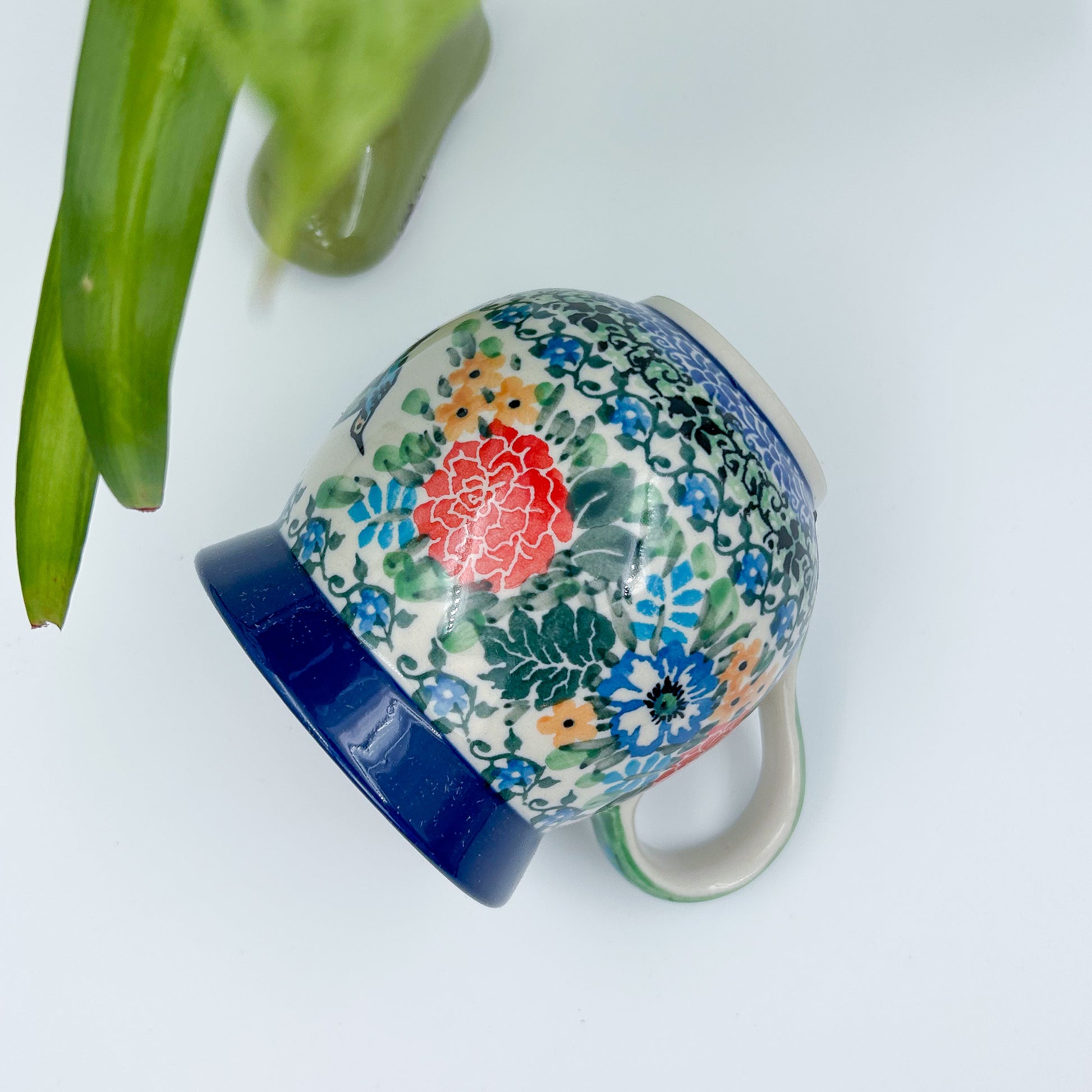 12 oz Polish Pottery floral UNIKAT bubble mug is made by talented artisans from Poland. 
Dimensions 5" x 3.66" x 3.78"
Ceramika Artystyczna Company