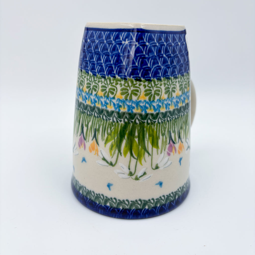 Close-up of blue geometric band and snowdrop pattern on XL mug