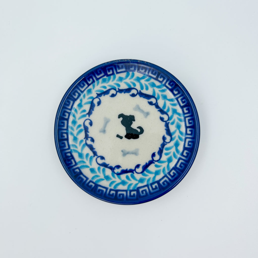 Puppy Plate, top-down view showing silhouette dog and bones on Greek key and vine border