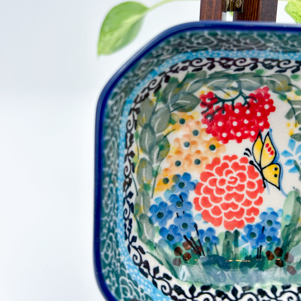 Close-up of butterfly and floral bouquet on Butterfly Garden square bowl