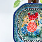 Close-up of butterfly and floral bouquet on Butterfly Garden square bowl