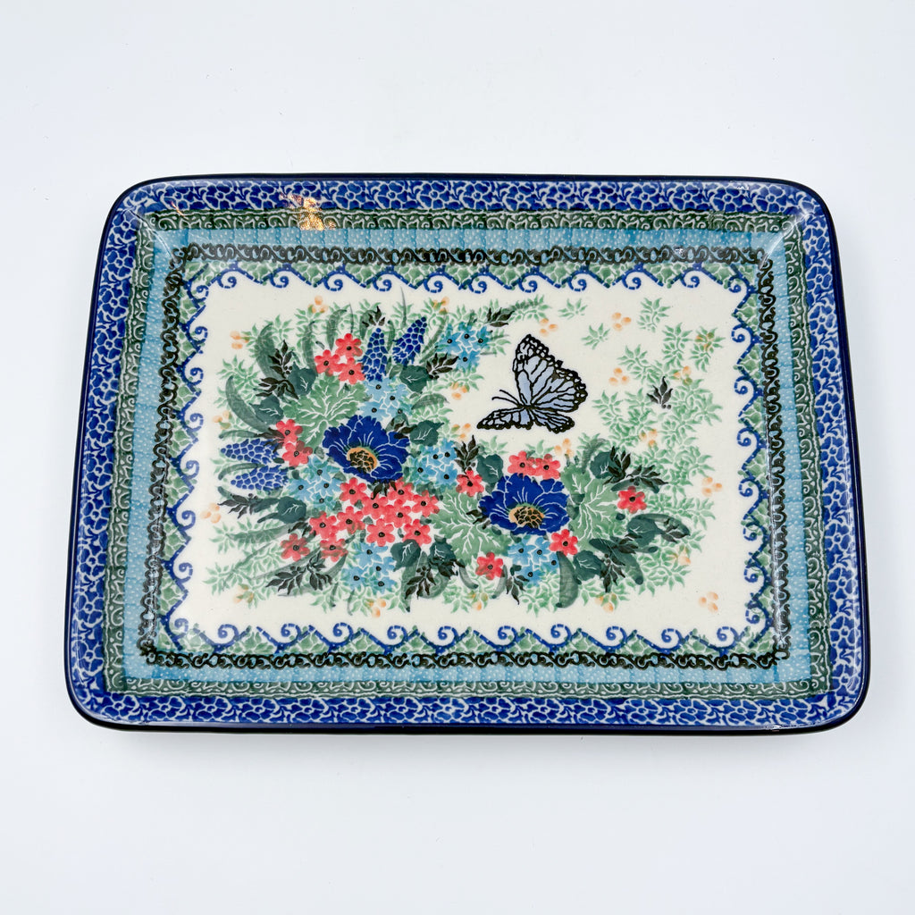 Mariposa rectangular platter, angled corner view of full floral bouquet and butterfly with layered border