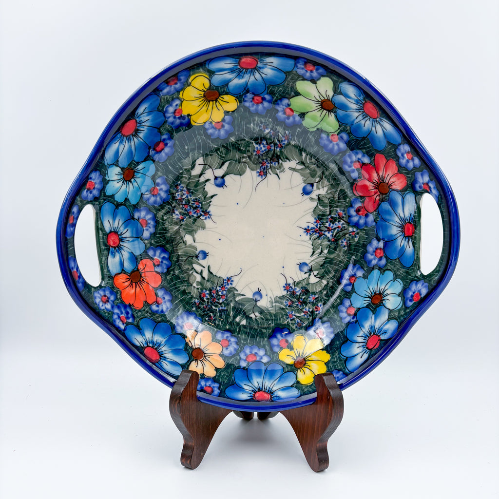 Forget Me Not Pansy handled bowl on display stand, top-down view showing full floral rim