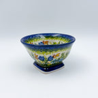 Bluebell Meadow small pedestal bowl, front view on pedestal foot showing bluebell and butterfly pattern