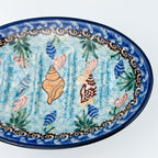 This 6” Polish pottery soap dish. UNIKAT Ocean Whisper pattern, that is hand painted with shells and aquatic life.
Ceramika Artystyczna Company
5.75" X 3.86" x 1.81"