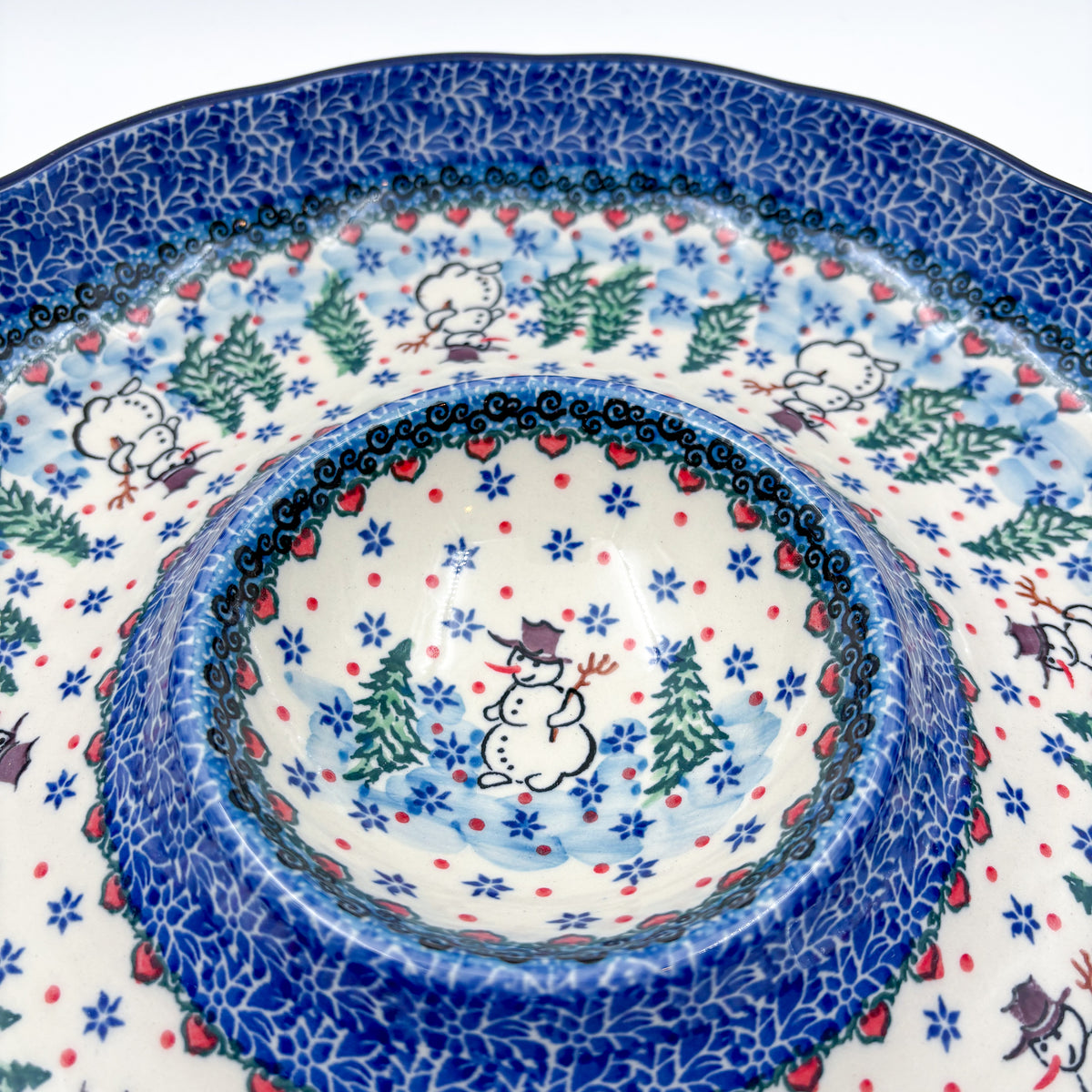 Dancing Snowman chip and dip platter, close-up angled view of scalloped rim, dip bowl, and snowman with heart border