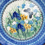 UNIKAT Sweet Nectar plate, top-down view of iris, yellow flowers, and gray butterfly center