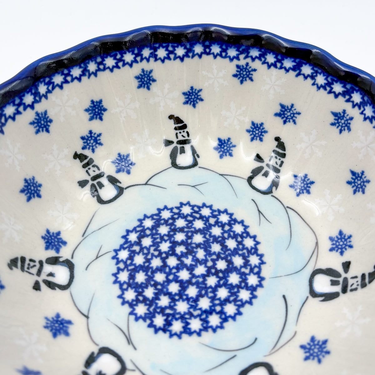 Snowman Penguins Design shell bowl, close-up top view of snowman figures and snowflake pattern