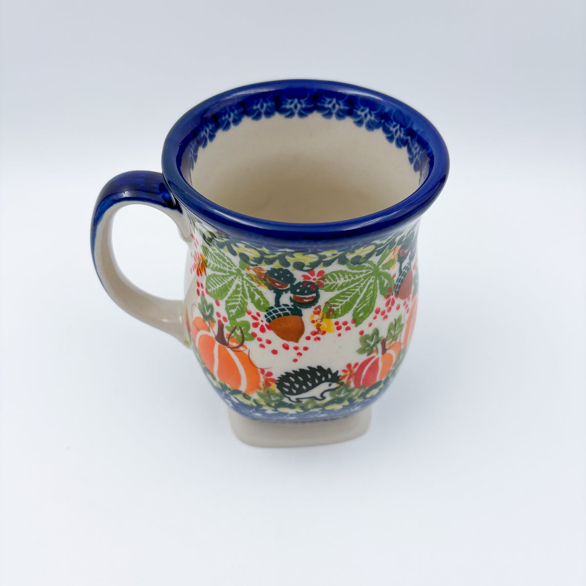 Hedgehog and Pumpkins tulip mug, angled top view