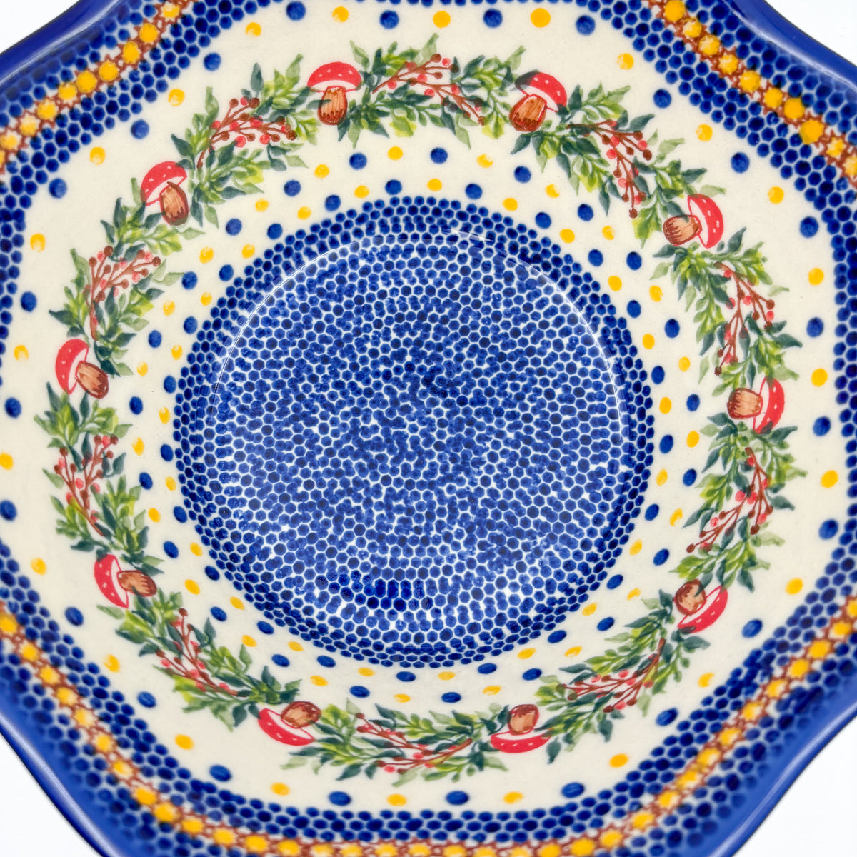 Mushroom Design wavy bowl, top-down close-up of mushroom wreath and blue dotted center detail