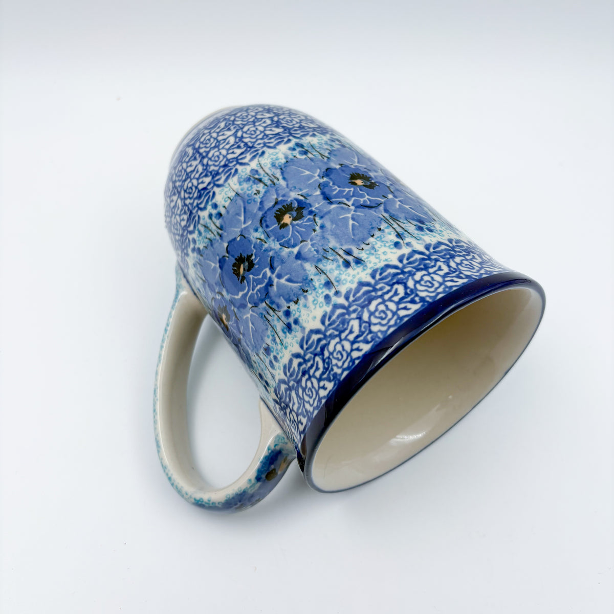 Deep Winter latte mug tipped on its side showing interior and pattern
