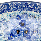 UNIKAT Deep Winter oval bowl, close-up rim detail showing dark blue rose border and pansy cluster
