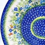 UNIKAT Bluebell Meadow XL oval platter, close-up view of bluebells, bees, and mosaic rings