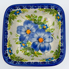 Blue Daisy square bowl on white background, top-down view
