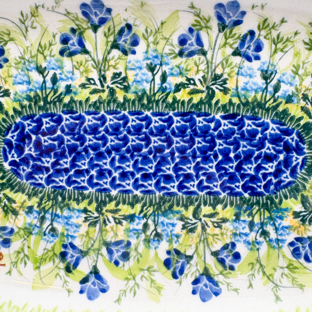 UNIKAT Bluebell Meadow oval platter, close-up of oval mosaic center band and bluebell field