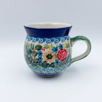 Butterfly Garden bubble mug on white background, angled front view