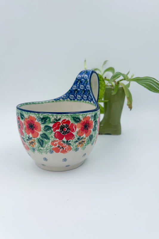 Polish pottery 16oz bowl with loop handle in the UNIKAT Candy Red Poppy pattern. It holds 16 oz of fluid.
Ceramika Artystyczna Company