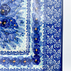 UNIKAT Deep Winter square plate, close-up corner view showing pansy border and rose pattern border