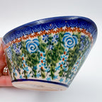 Whispering Ferns oval tub bowl held in hand, side view showing exterior pattern