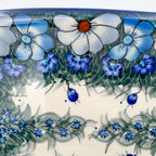 UNIKAT Forget Me Knot Pansy Daria platter, close-up rim detail of pansy border and blue berries with fern band
