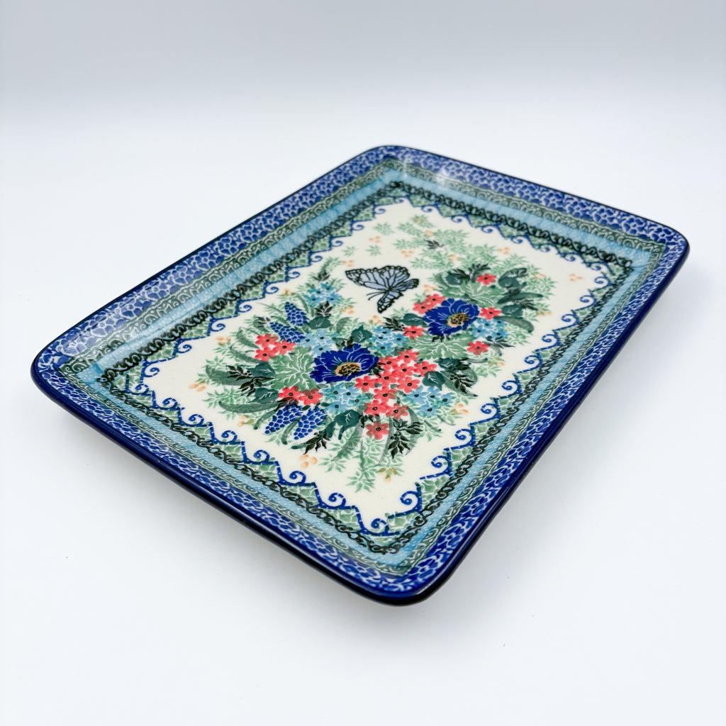 Mariposa rectangular platter, angled top-down view of full platter with butterfly and floral bouquet