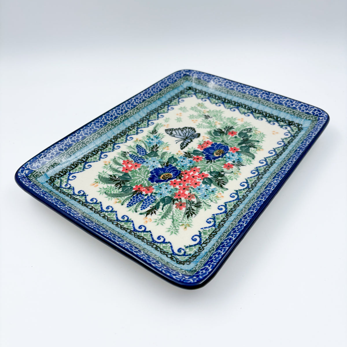 Mariposa rectangular platter, angled top-down view of full platter with butterfly and floral bouquet