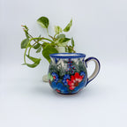 Forget Me Not Pansy bubble mug on white background, straight-on view
