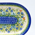 UNIKAT Bluebell Meadow oval platter, close-up end view of bluebell field, bees, and mosaic center