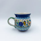 Butterfly Garden bubble mug on white background, straight-on front view
