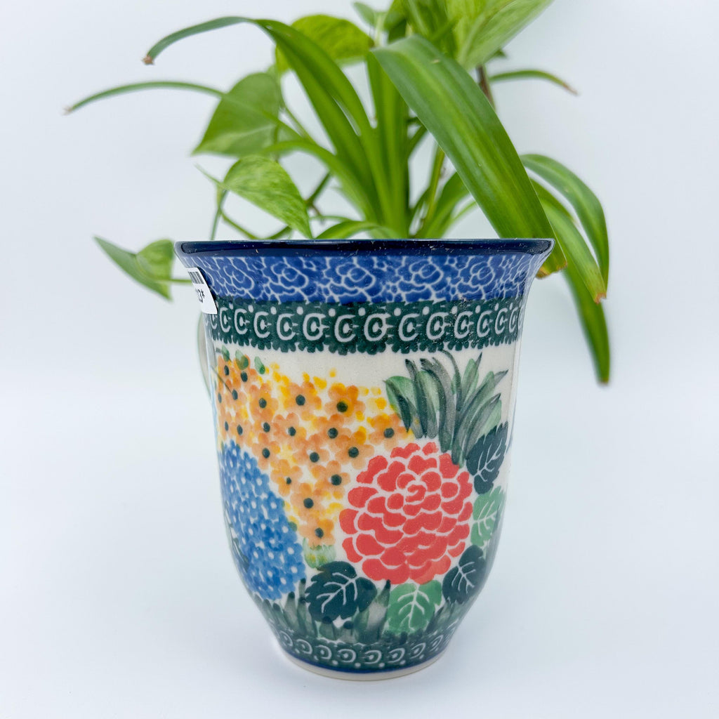 Spring Garden bistro mug on white background, front view showing colorful floral cluster