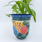 Spring Garden bistro mug on white background, front view showing colorful floral cluster
