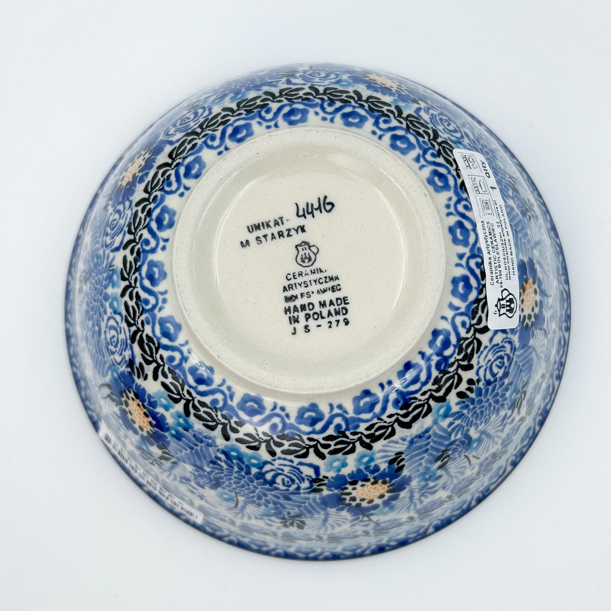 Bottom of Fields of Blue stacking bowl showing Unikat stamp and artist signature