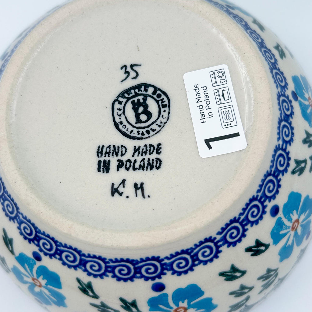 Bottom of Blue Cornflower deep bowl showing Ceramika Bona stamp and artist initials